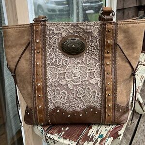 Brown leather Justin western purse.